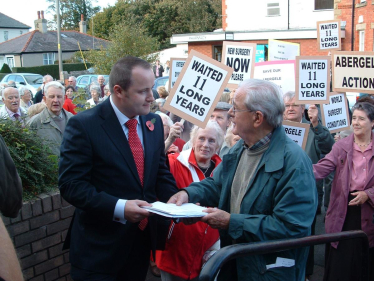 Darren Millar AM receiving a petition in Abergele